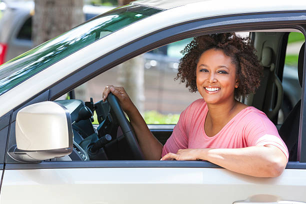 African American Girl Young Woman Driving Car stock photo