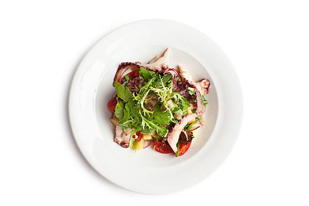 istock Close-up of octopus salad with lettuce 487740258