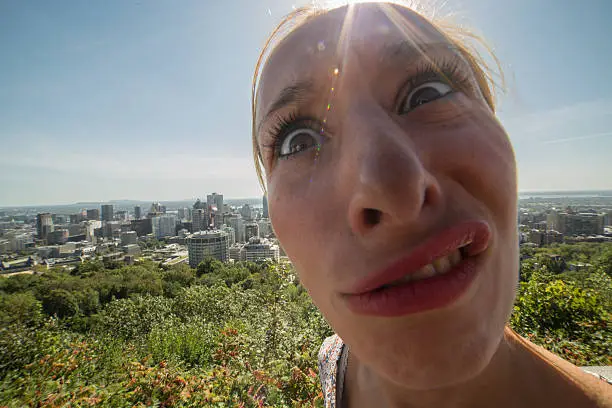 Photo of Fish eye image of strange woman taking selfie in Montreal