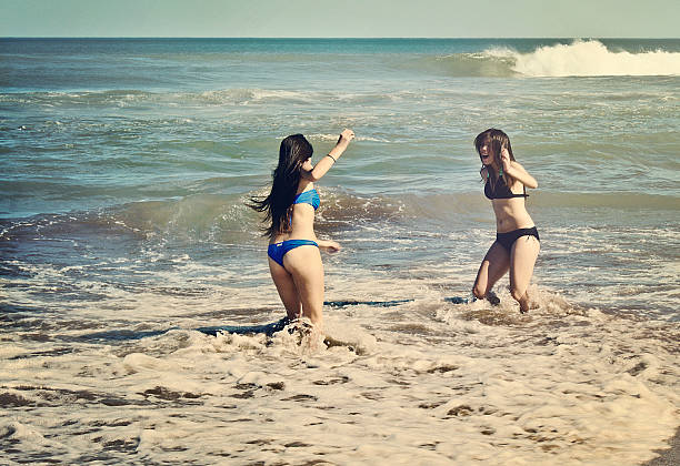 istock Teenagers playing in the sea 487743984