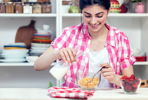 Beautiful Young Girl Preparing Healthy Breakfast