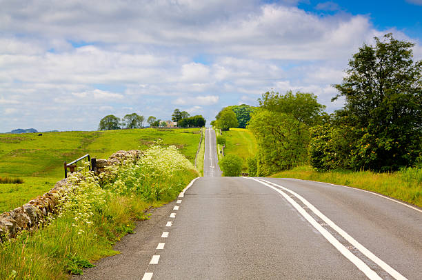 istock Landscape with Rural Road, Cumbria, England. 487744542