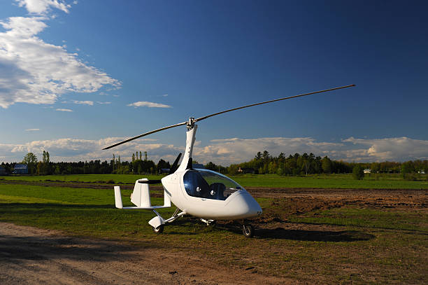 White gyroplane parked on the private airfield White gyroplane parked on the private airfield in the sunny day ultralight photos stock pictures, royalty-free photos & images