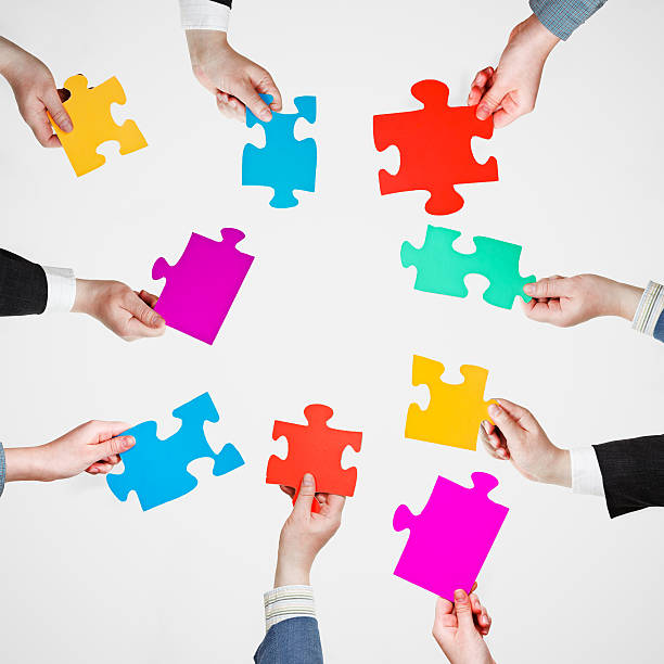 istock set puzzle pieces in people hands in circle 487745777