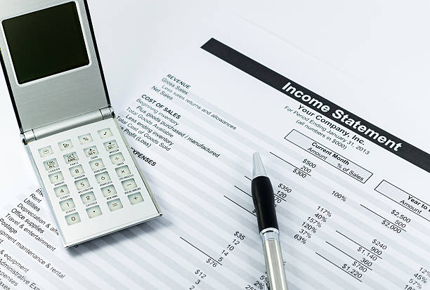 istock income statement report with calculator and pen for business 487747261