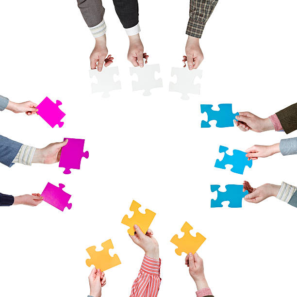 istock sides with people hands holding puzzle pieces 487747741