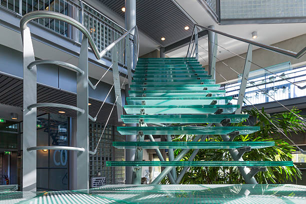 istock Glass stairway in a modern office building 487747753