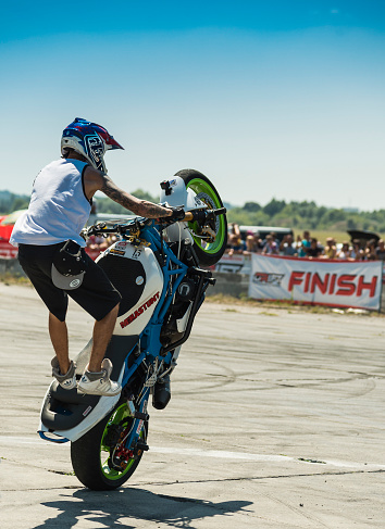  Vinnytsia,Ukraine-July 25, 2015: Unknown stunt biker entertain the audience before the start of the championship of drifting   on July 25,2015 in Vinnytsia, Ukraine.