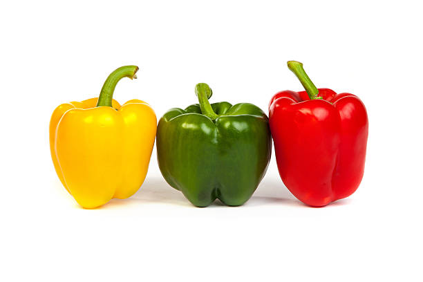 istock Group of seet bell peppers isolated on white 487751223