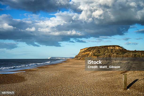 Landscape Vivd Sunset Over Beach And Cliffs Stock Photo - Download Image Now - Beach, Cliff, Color Image