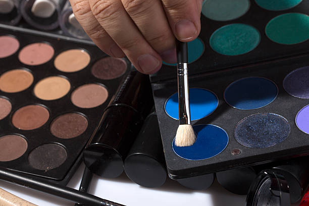 istock Male hand and set of eyeshadows 487756024