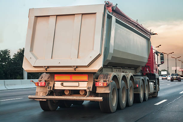 istock dump truck goes on highway 487756290