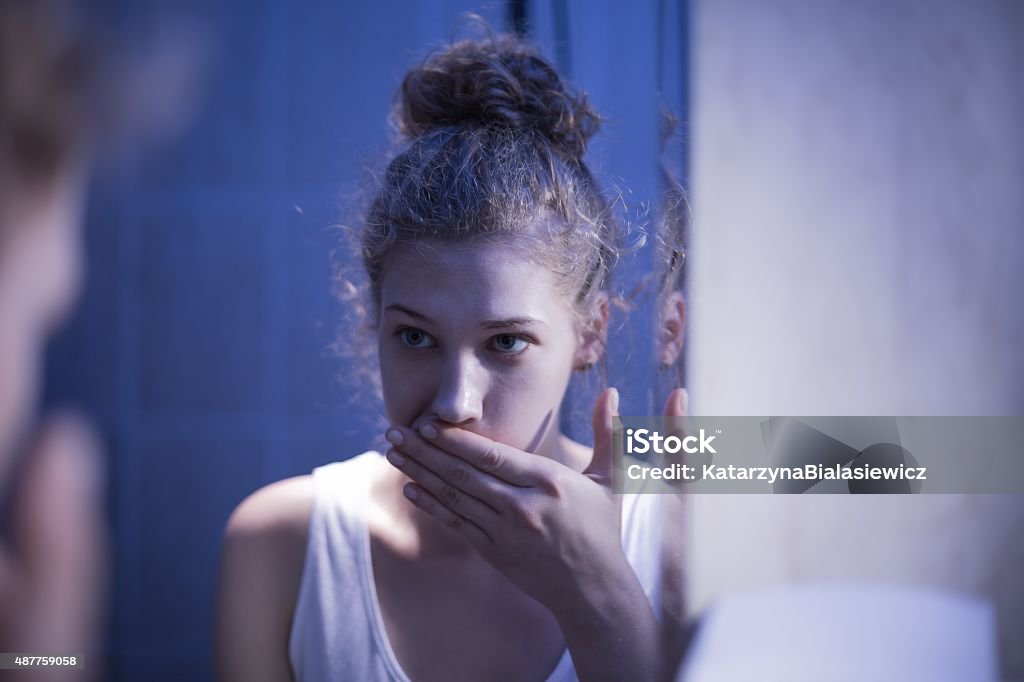 Vomiting girl suffering from bulimia Image of young vomiting girl suffering from bulimia 2015 Stock Photo