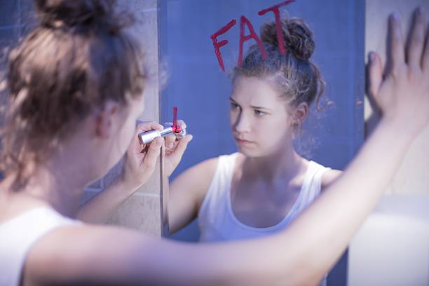 istock Girl thinking she is fat 487759108