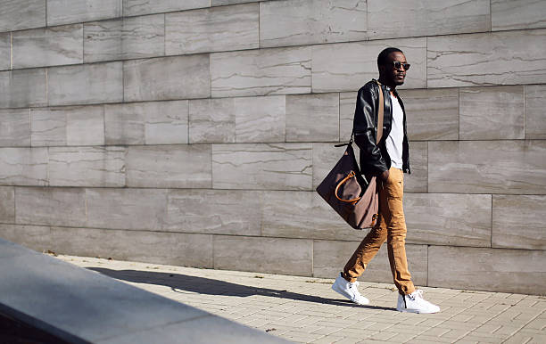 Fashion stylish young african man in city stock photo