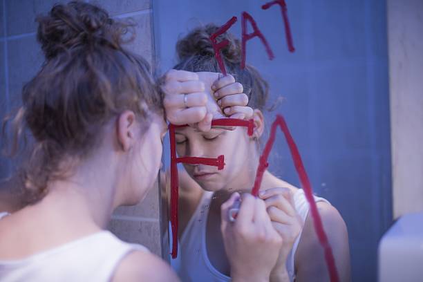 istock Bulimic girl and writing fat 487764920
