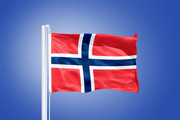 istock Flag of Norway flying against a blue sky 487765772