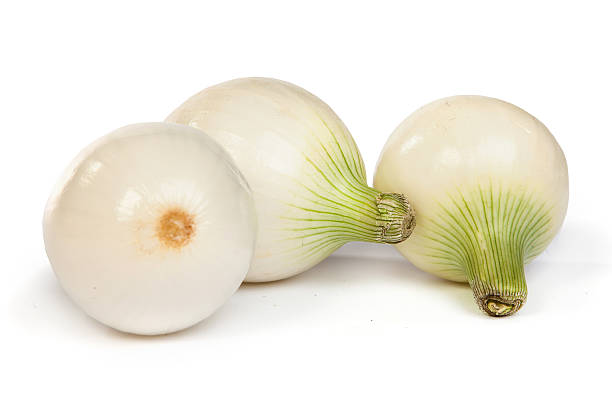 istock Group of a onions, isolated on white 487767799