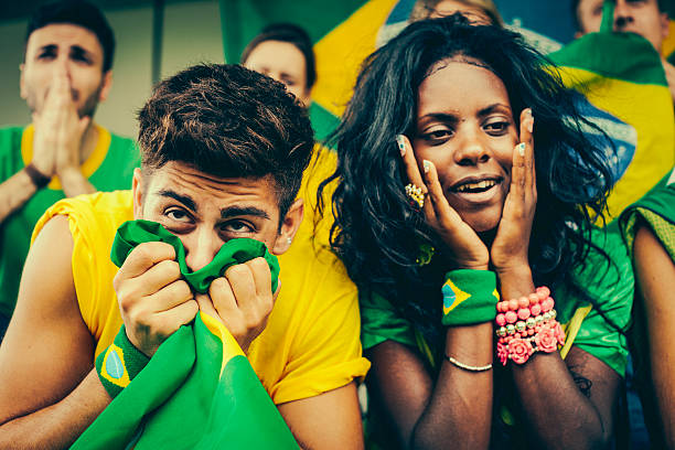 istock Worried Brazil Supporters at the Stadium 487772167