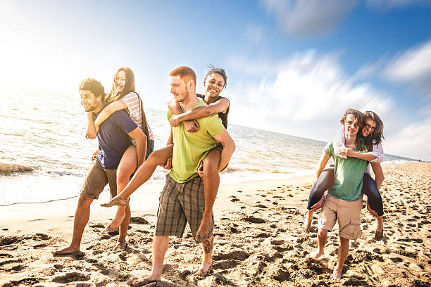 istock Group of multi-ethnic friends on the beach 487772927