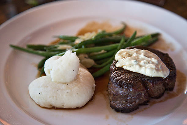 istock beef tenderloin with whipped potatoes and green beans 487774293