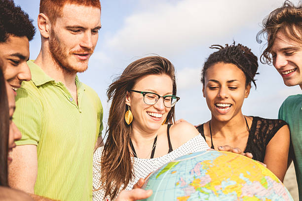 istock Group of friends holding an earth globe 487774523