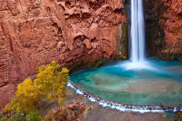 Mooney Falls dropping into it's turquoise pool, Havasu Canyon, Arizona havasupai indian reservation stock pictures, royalty-free photos & images