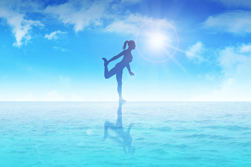 Silhouette illustration of a woman meditating on water