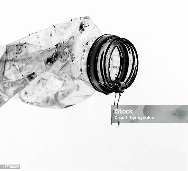 Pouring Water From Used Plastic Bottle Stock Photo - Download Image Now - Black Color, Bottle, Close-up