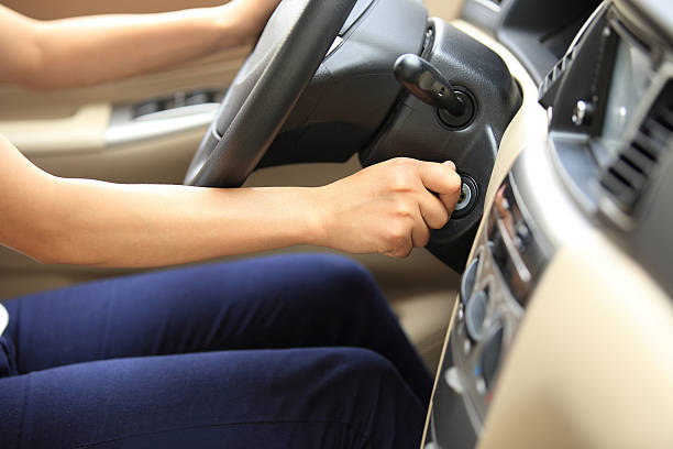 istock woman driver starting the car 487780615