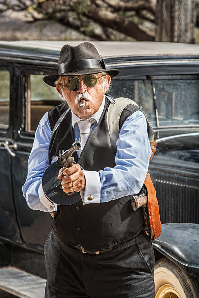 istock Male Gangster Aiming Machine Gun 487783221