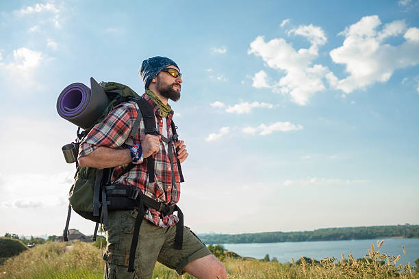 istock Young caucasian man with backpack standing on the top of 487783790