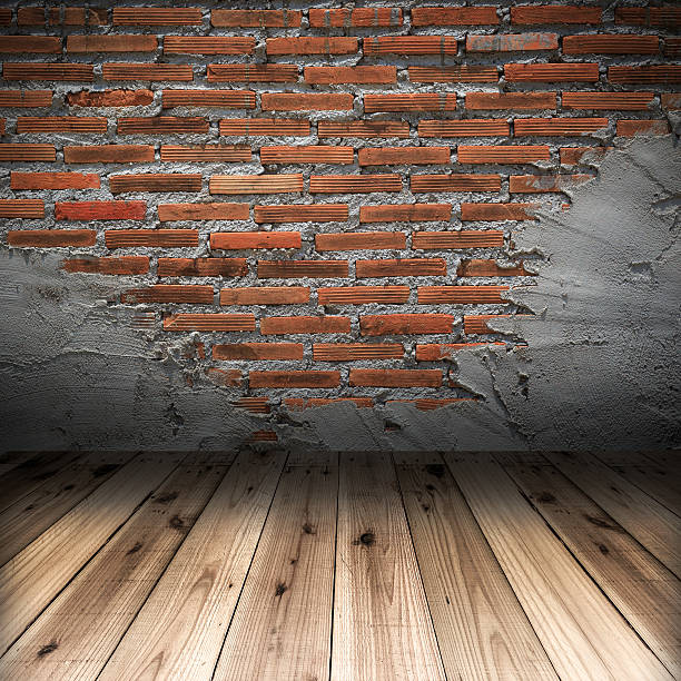 istock red brick wall and wood floor 487784877