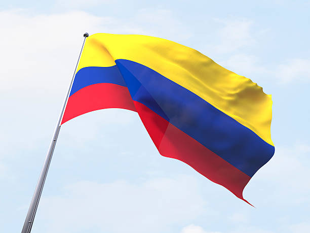 istock Colombia flag flying on clear sky. 487790152