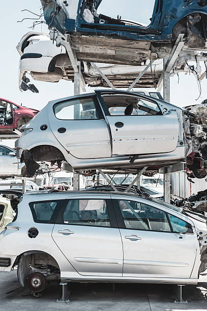 istock Crashed cars and auto parts in a dismantling yard. 487790458