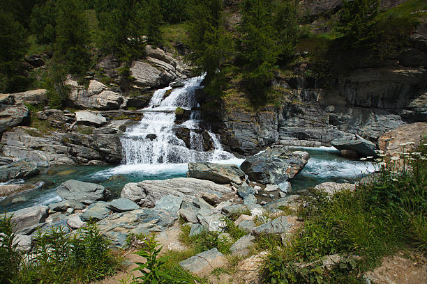 Lillaz waterfall cascades near Cogne, Aosta Valley, Alps, Italy stock photo