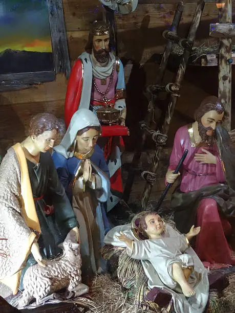 Photo showing a traditional Christmas nativity scene with some religious statues and figure on display, including Mary, Joseph and the baby Jesus.  This display was pictured on the public plaza in Bournemouth town centre during the month of December.