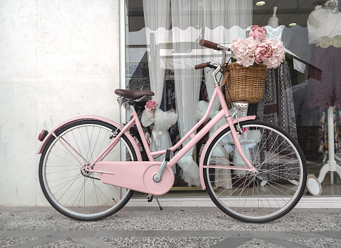 Pink bicycle decorated for weddings
