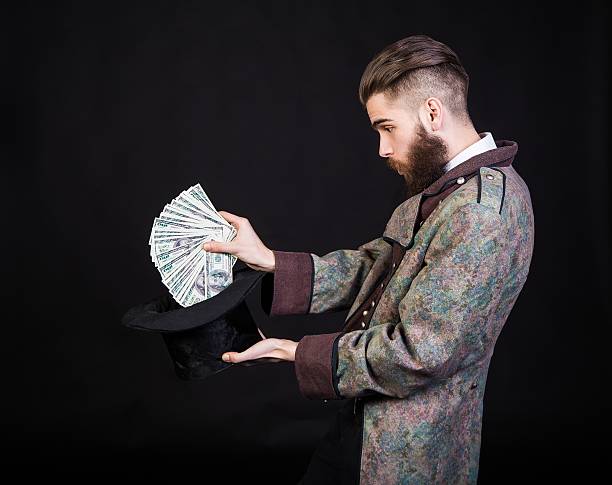 More money Man pulling out money from a magical hat. magician money stock pictures, royalty-free photos & images