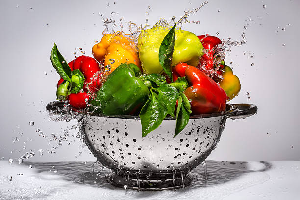 istock Yellow, green and red peppers in a colander 487796998