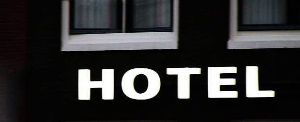istock View Of Hotel Sign In The Evening 487797328