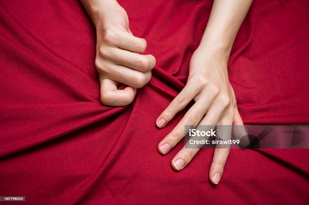 hand grasping on bed sheet 1 hand grasping on bed sheet 2015 Stock Photo