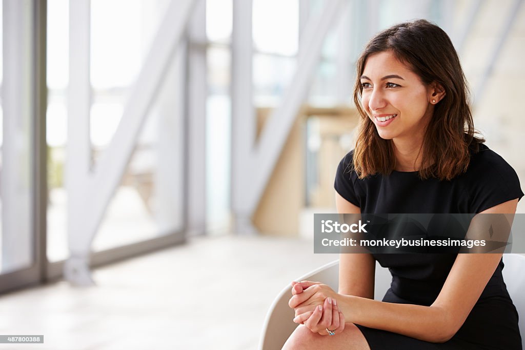 Young mixed race Asian businesswoman looking away Looking Away Stock Photo