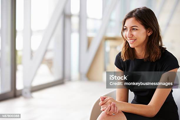 Young Mixed Race Asian Businesswoman Looking Away Stock Photo - Download Image Now - Looking Away, Portrait, Smiling