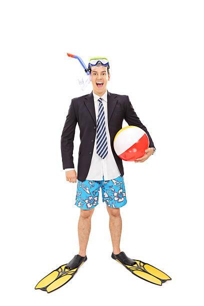 istock Businessman with a diving mask holding a beach ball 487801014