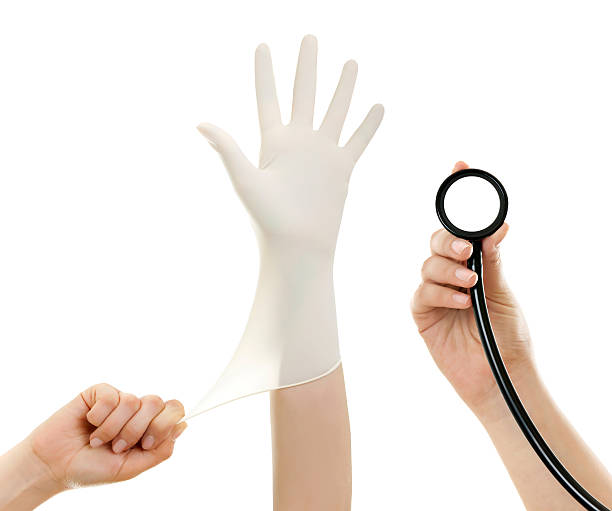 médecins la main dans le gant blanc hygiénique et stéthoscope à la main - antibakteriell photos et images de collection