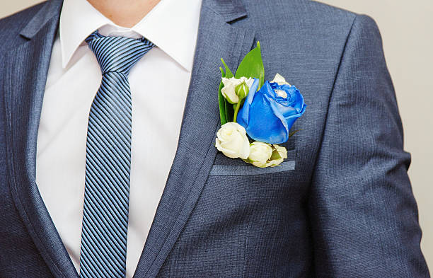 istock Businessman in blue suit tying the necktie 487801866