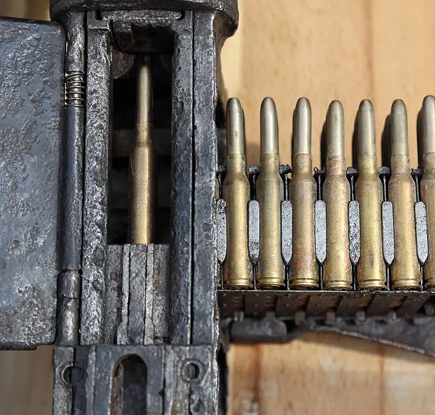 charger with many a machine-gun bullets during a military war exercise