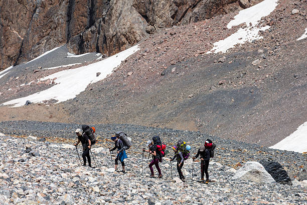 istock People traveling in mountains 487804378