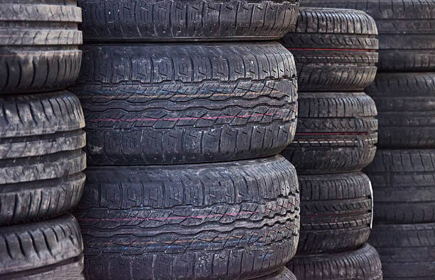 istock Used old car tires at workshop. 487804799